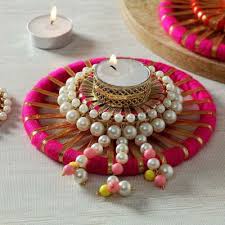 A representation of a person or scene in the form of a print or transparent slide; Tea Light Candle With Decorative Platter Gift Send New Year Gifts Online J11102164 Igp Com Diwali Decoration Items Diwali Craft Tea Light Candle