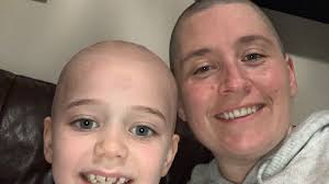 Mum shaves head after daughter is diagnosed with brain tumour