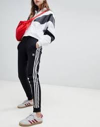 Adidas Originals Three Stripe Cuffed Sweatpants In Black Shop Adidas Originals Three Stripe Cuffed Sweat Pants In Black At Asos Discover Fashion Online Adidas Sweatpants Outfit Adidas Jogging Pants Adidas Sweats