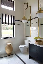 Stylish Black And White Bathroom Boasting Gold Accents Features Hicks Pendants Hung In Front Of Restoration Hard Elegant Bathroom White Bathroom Black Bathroom