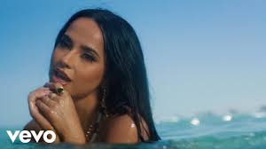 Becky G Is a Beachside Mambo Baddie in New 'Arranca' Video With Omega
