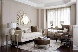 Light beige curtains bring softness to the large window, while the vanity and side table pick up the gray tones from the walls. Neutral Debates Grey Vs Beige In Your Decor Huffpost Canada Style