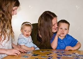 You might think that the number of males in the world is equa. Mom And 3 Kids 4 Year Boy 8 Year Old Girl And Baby Girl Are Enjoying Family Time Together By Doing A Puzzle On A Table Stock Photo Picture And Royalty Free Image Image 4709646