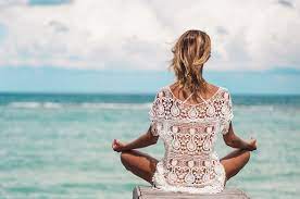 Beautiful woman doing yoga in the beautiful sky with sunrise background. Outdoor Yoga Perfection In The Caribbean Ibbean Com