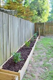 Mark the cut lines on the 4×4 rough cedar posts and then get the job done with a circular saw. Raised Garden Beds To Hide Weeds Along The Fence Line Make It Easier To Mow Diy Raised Garden Building A Raised Garden Raised Garden