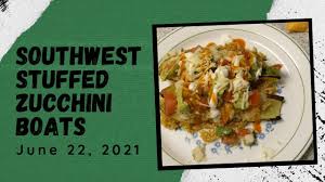 Evenly distribute the filling mixture between the zucchini boats. Wcaku8rgcdzxtm