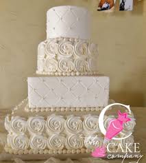 4 Tier Light Ivory Cake With Rosettes Quilt Press And Edible Pearls At The Intersections Quilted Cake Cake Rosette Cake