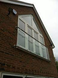 Spacious primary suite with room for king bed, ensuite bath, and 2nd balcony. Bespoke Oxford Glass Juliet Balconies