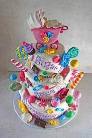 Sugar And Spice And Everything Nice Baby Shower Cake For Twin Girls Candy Themed Baby Shower Baby Shower Cakes Shower Cakes