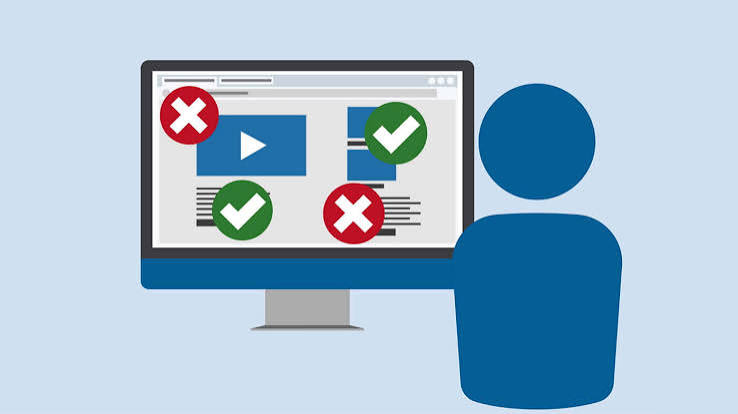 A simplified image of a person in front of a computer which displays non-specified examples of accessible vs. inaccessible internet content. 