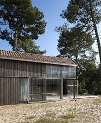Beach Cottage Covered By A Dark Wood Cladding Java Architecture Weekend House Architecture Exterior