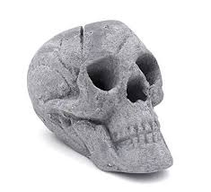 A fire pit or a fire hole can vary from a pit dug in the ground to an elaborate gas burning structure of stone, brick, and metal. Osker Ceramic Fireproof Faux Human Skull Logs For Wood Or Gas Fire Pit Fireplace Campfire Bbq Or Halloween Decora Gas Firepit Skull Goth Decor