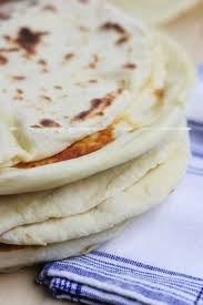Learn The Basics Of Making Homemade Naan An Easy Fluffy Skillet Bread That Goes Perfectly With Recipes With Naan Bread Bread Recipes Homemade Skillet Bread