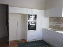 Usually, chimneys with ducts are more effective, but its ducting, pipes disturb the kitchen's aesthetic sense. What Do Other People Put In Small High Cupboard Over Stove Fridge