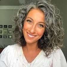 Use good hair products to minimize frizz, boost volume, and tame unruly curls. 10 Women Embracing Their Silver Curly Hair That Are Redefining Natural Hair Naturallyc Curly Hair Styles Naturally Natural Curls Hairstyles Curly Hair Styles