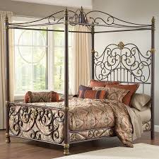Edged with iron corners finished in glam plated brass, dark design rises 80 high from the ground. Metal Canopy Bed With An Ornate Scrolling Design Product Bed Construction Material Metal Colo Canopy Bed Frame Iron Canopy Bed Metal Canopy Bed