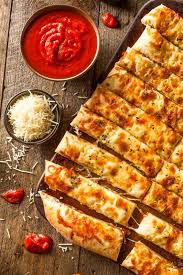 3 Easy Recipes Using Trader Joe S Pizza Dough Recipe In 2020 Garlic Breadsticks Cheesy Breadsticks Easy Italian