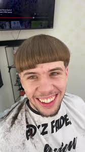 Bowl Cut and Gold Hoop Earrings: A 90s Inspired Look