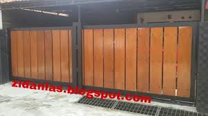 Pagar besi kombinasi kayu minimalis bagus asli terpercaya. Pintu Gerbang Atau Pintu Pagar Besi Kombinasi Kayu Kamper Pemasangan Di Kembangan Beji Depok Bengkel Las Listrik