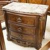 A grand queen size sleigh bed serves as the rightful centerpiece, showcasing elaborate carvings, beadings and more, as well as a tufted headboard upholstered in alluring dark bonded leather. 1