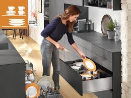 Gray and white can both help to tame bold shades of orange while dark plum is a sophisticated and chic accent. Ideas For Practical Kitchens Blum