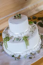 Consider a christmas wedding cake shows off the traditional reds, greens, whites, and blues of the season. Tiered White Wedding Cake With Wildflower Accents
