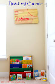 21 incredible reading nooks you will want in your house. Cute Little Toddler Reading Nook Love The Sign On The Wall Made From An Old Baby Gate Reading Corner Baby Playroom Kids Playroom