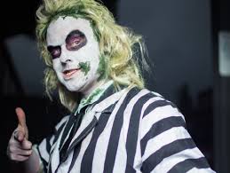 Use white face makeup (full coverage, duh), then use green and purple paint to give yourself a gross. Beetlejuice Costume Guide Go Go Cosplay