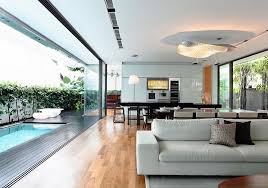 With millions of inspiring photos from design professionals, you'll find just want you need to turn your house into a large peninsula overlooks the dining and living room for an open concept. 8 Airy Homes With Giant Glass Walls That Open To Courtyards