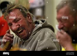 Andre Boulin, left, and Vincent Horner who are both homeless laugh during  their Thanksgiving meal at CityTeam Ministries in Chester, Pa., Thursday,  Nov. 25, 2010. CityTeam is a non-profit organization that does