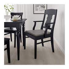 From the color choice to the material, dining chairs serve as a great accent in this space. Ingatorp Black Nolhaga Grey Beige Grey Beige Chair With Armrests Ikea At Home Furniture Store Painted Seating Modern Furnishings