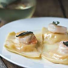 This butternut squash soup recipe is the best! Butternut Squash Ravioli With Prawns Truffle Oil Sauce Cooks With Cocktails Recipe Butternut Squash Ravioli Butternut Recipes Scallop Recipes