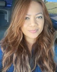 should i change my hair color to light brown or dark blonde at 57?