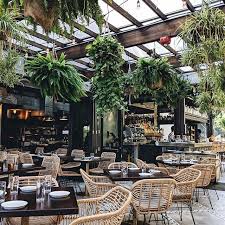 Beautiful Botanical Plant And Rattan Furniture Setting In This Restaurant Botanical Restaurant Outdoor Restaurant Patio Restaurant Patio Outdoor Restaurant