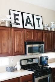 There's even an example from martha stewart herself! Decorating The Kitchen The Tomkat Studio Blog Decorating Above Kitchen Cabinets Kitchen Cabinets Decor Above Kitchen Cabinets