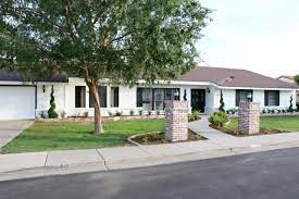Love our curb appeal now. Modern Ranch House Our Black And White Exterior Paint Classy Clutter Ranch House Exterior White Exterior Houses White Ranch Style House