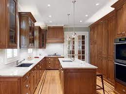 If stained cabinets are part of your kitchen design and you are planning a wood floor, then the stain colors should be complimentary, but do not need to match. Kitchen Tones If We Did A Lighter Floor And Hardware Especially Keeping White Tile Backsp Medium Wood Kitchen Cabinets Brown Kitchen Cabinets Brown Cabinets