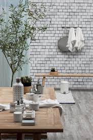 The photograph shows a large gathering of area citizens and a brass band. Spring Summer 2015 Lene Bjerre Design Grethel Coll Bench Table Acacia Coll Jar Bottle Tray Scarpa Bath Coll Marlena Bath Coll Portia Bath Coll