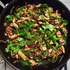 Stir Fried Chicken Green Peppers And Cilantro With Xian Province Flavors Of Cumin And Coriander C H E W I N G T H E F A T