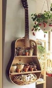 We Love To See Items Turned Into Garden Planters This Is So Creative Guitar Wall Planter Oddpot Ho Upcycled Home Decor Upcycle Decor Diy House Projects