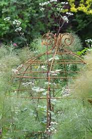 * plastic coated plant support with a metal core * rustproof with water tight closures on both ends *wont rot or split *lightweight for indoor or outdoor use *spurs. Plant Belles Are Metal Grow Through Plant Supports Plant Belles Also Make Unique Plant Tunnels Plant Crooks Plant Labe Plant Supports Plants Rhs Flower Show