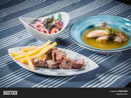 A salad bar is commonly offered in delicatessens and supermarkets, in which customers help themselves to lettuce and other salad ingredients, then pay by weight. Set Three Dishes Image Photo Free Trial Bigstock