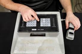 The sultan of scorekeeping, Grant Buehler makes it look easy