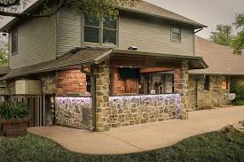 a rustic outdoor kitchen addition