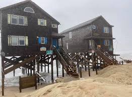 Many homes on the outer banks, with the exception of properties that are located well above sea level, are located in a flood zone, which means that in addition to the standard homeowner's insurance, prospective buyers will be required to purchase a flood insurance policy as well. Outer Banks House Vanishes In The Dark As Ocean Claims Beach Charlotte Observer