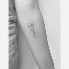 In this fantasy theme tattoo, a tiny blue flower fairy sits kneeling amongst twin orange calla lilies. Fine Line Calla Lily Tattoo On The Inner Forearm