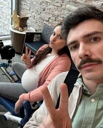 Can finally check "burst through a paper banner while pretending to be in  labor after being pushed through a balloon tunnel with @peytonmanning ,  Miles, The Stampede, and @denverbroncoscheer " off my