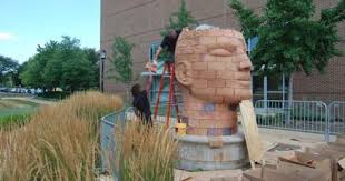 Interactive heads going up outside Pao Hall