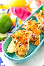 Corn tortillas are loaded with a quick slaw, fish sticks (baked or air fried), and an irresistible lime crema. Fish Sticks Wonton Tacos Recipe Sugar Soul Co
