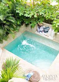Backyard swimming pool surrounded by hedge trim. Perfectly Pocket Sized Pools For Small Outdoor Spaces Backyard Pool Small Pool Design Swimming Pools Backyard